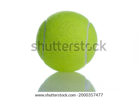 Tennis light green ball on white reflective background