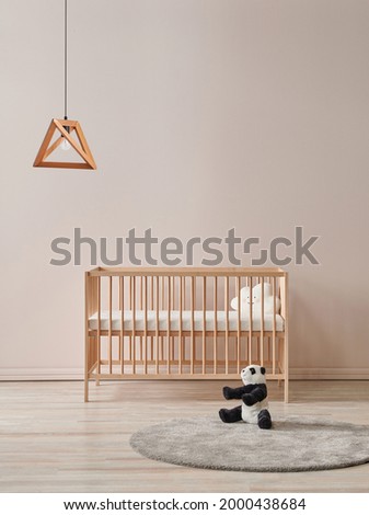 Baby room lamp concept with wooden crib toy and carpet style.