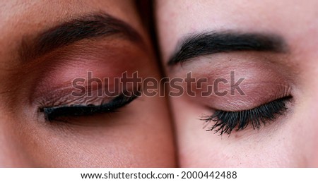 Two beautiful diverse women eyes macro close-up, diversity