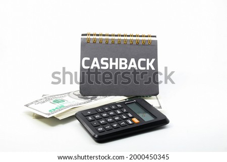 banknotes, notebooks, calculators and the word CASHBACK