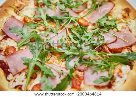 A boring fast food dish pizza. Italian cuisine. Cooking in a restaurant or with your own hands at home.