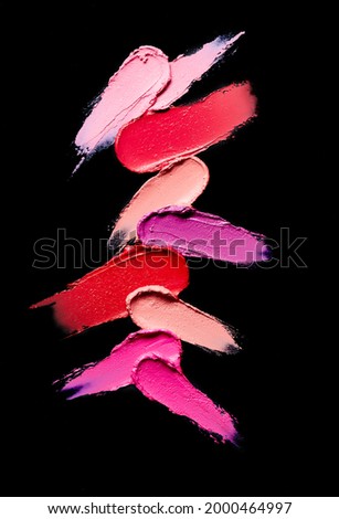 range of colour make-up swatches on a black background