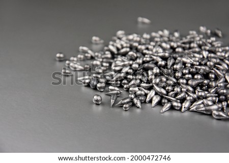 Pure lead metal stock images. Lead chemical element. Laboratory equipment on a silver background. Pb, chemical element stock images