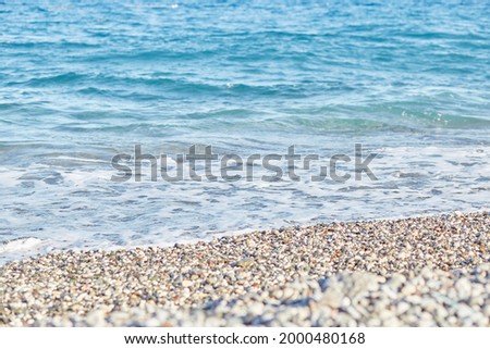 Beautiful Mediterranean sea and waves backgrounon sunny day. Summer and restconcept. Summer texture. Bright wallpaper. Turquoise seawater. Royalty-Free Stock Photo #2000480168
