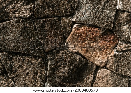 Stone background, rock texture with an interesting structure.