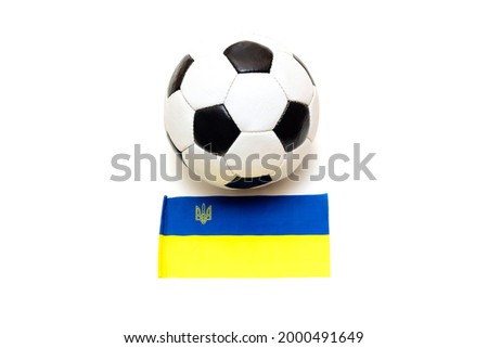 Soccer ball and flag of Ukraine are isolated on a white background. Football concept.