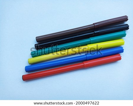 Multi-colored markers on a white background. Drawing, creativity, education, school, kindergarten, hobby