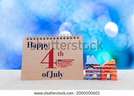 Happy independence day fourth of July, holiday calendar with colorful wooden house with us flag pattern