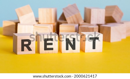 rent word construction with letter blocks and a shallow depth of field, business concept