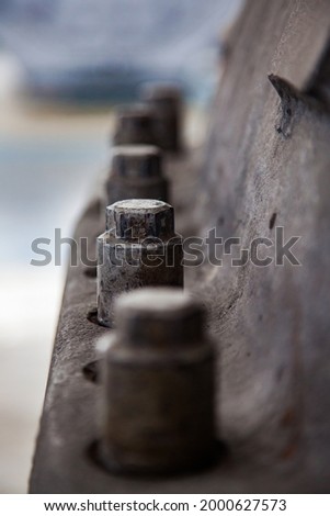 Close up photo of steam turbine cast iron body cover. Old rusted bolts. Low depth of field. Atyrau,Kazakhstan.