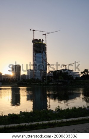 tower under construction in summer sunset
