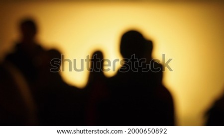 Peoples silhouettes on colorful background