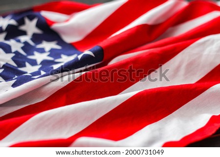 American flag on a black wooden floor.