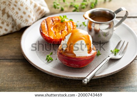 Grilled peaches with ice cream and caramel sauce, summer dessert idea