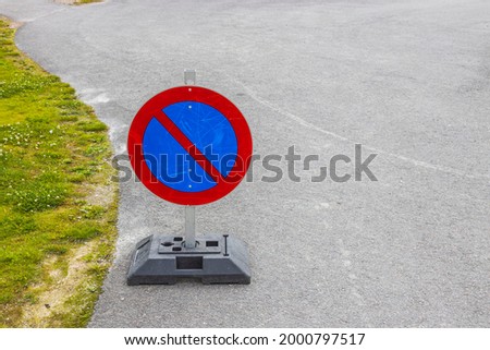 Close up view of temporary traffic sign on asphalt road. Sweden. 