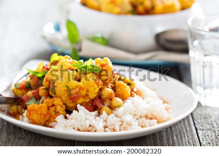 Vegan curry with chickpeas, tomatoes and cauliflower Royalty-Free Stock Photo #200082320