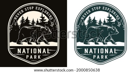 National park vintage logotype in monochrome style with walking bear on forest landscape isolated vector illustration Royalty-Free Stock Photo #2000850638