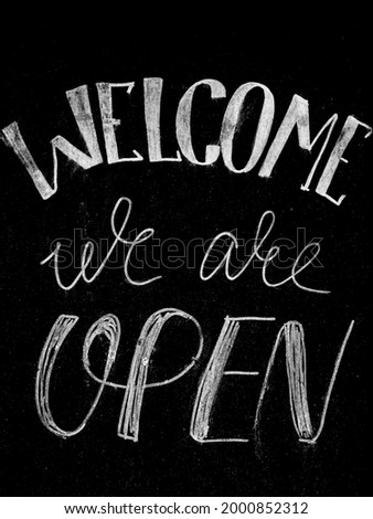 Welcome, we are open . black Chalkboard. lettering sign. We are open chalk a board shop sign
