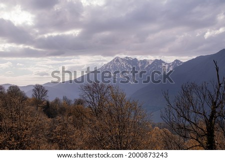 a bleak view of the mountains in cloudy weather