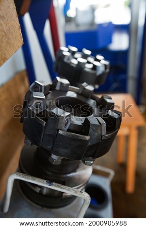 Close up of CNC turning lathe cutter tool. High-toughness drill with hard alloy teeth. Low depth of field. Atyrau, Kazakhstan. Royalty-Free Stock Photo #2000905988