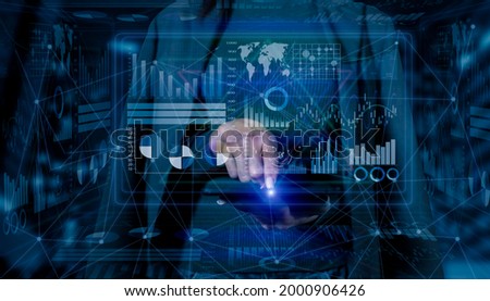 Double exposure of businesswoman using tablet with digital screen and HUD business infographic interface, Business and technology strategy concept. 