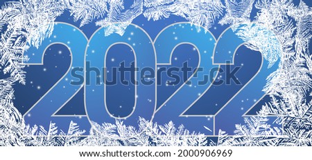 Chinese new year 2022 year. Frozen window background with hoarfrost patterns can be used for Christmas sale or New Year Party leaflet. Royalty-Free Stock Photo #2000906969