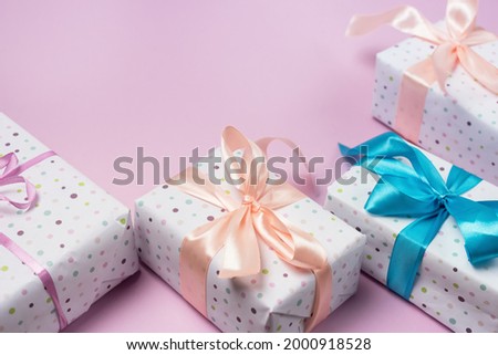 Present Boxes on Pink Background Greeting Card Holidays Concept Horizontal