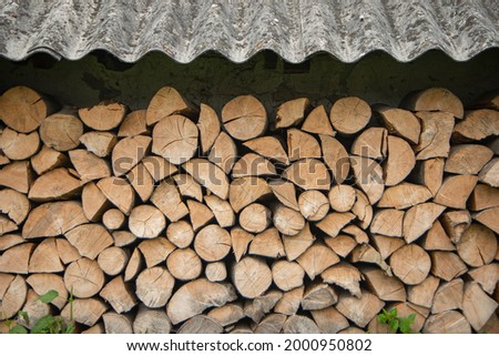 wood texture or light wood frame background, stacked wooden piles, firewood close-up,