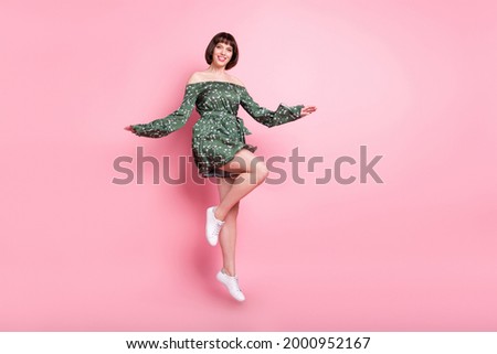 Full length body size view of attractive cheerful girl jumping good mood isolated over pink pastel color background