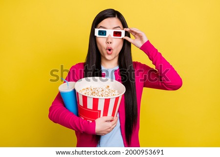 Photo of hooray brunette hair millennial lady hold pop corn soda wear eyewear pink sweater isolated on yellow color background