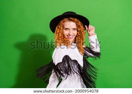Portrait of attractive cheerful wavy-haired girl dancing having fun good mood isolated over bright green color background