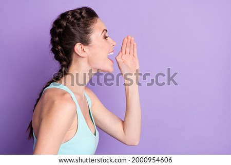 Side profile photo portrait of girl in tank-top shouting news on blank space isolated on pastel violet color background