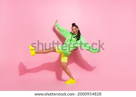 Full body profile side photo of dark skin young cheerful lady good mood smile dance isolated on pink color background