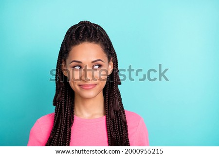 Photo of cute brunette hairdo millennial lady look empty space wear pink t-shirt isolated on teal color background