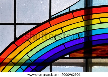 Celebration of Pride month concept with colored rainbow window and sunlight as background, Multi colorful of glass mosaic design, The symbol of gay, bisexual and transgender, LGBTQ community.