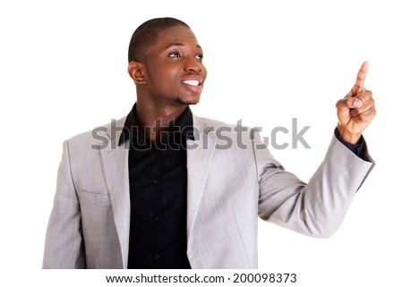Happy successful businessman pointing on copy space.