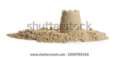 Pile of sand with castle on white background. Outdoor play Royalty-Free Stock Photo #2000988368