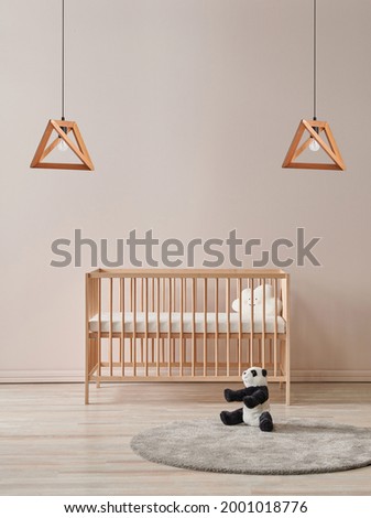 Baby room lamp concept with wooden crib toy and carpet style.