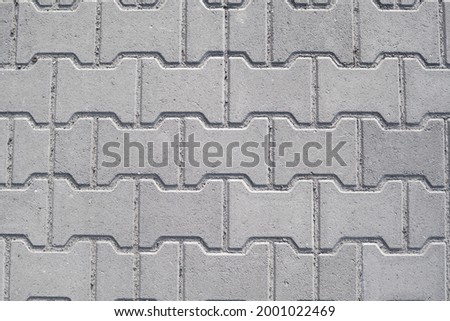 Brick pavement tile, top view. Urban texture as background.