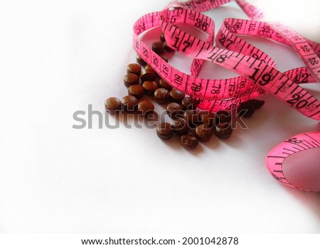 Diet pills and a tape measure. Weight loss ayurvedic treatment. Herbal medicine for Weight loss. supplements for weight loss. Weight loss concept.
 Royalty-Free Stock Photo #2001042878