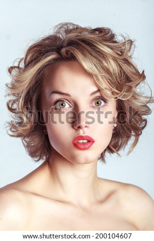 Shock surprise beautiful woman with opened mouth. Glamour studio photoshoot