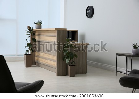 Lobby interior with stylish wooden receptionist desk