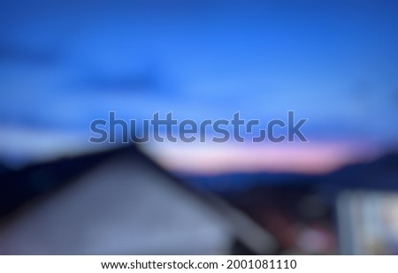 photo of house and blue sky out of focus or blur