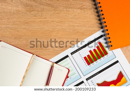 image of a business papers, calculator, notepad and pen. business still life