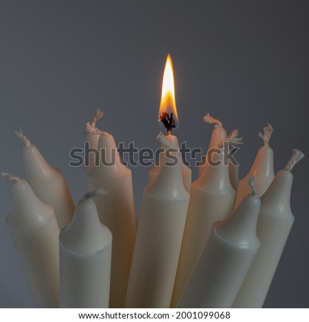 white candles on a white background