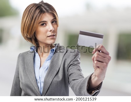 portrait of an executive young woman showing her credit card