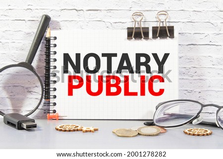 Conceptual hand writing showing Notary Public. Business photo text Legality Documentation Authorization Certification Contract Man holding marker paper clothespin reminder cup marker wood table.