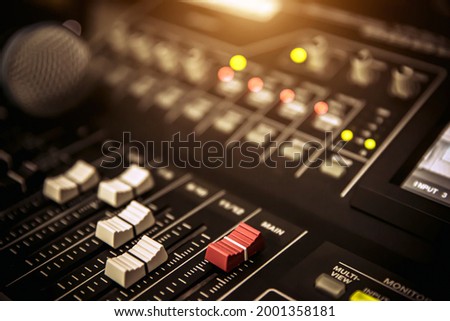 Sound mixer and microphone in studio for sound control system and audio recording equipment and music instrument.