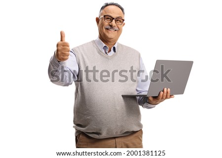Casual mature man holding a laptop computer and gesturing a thumb up sign isolated on white background