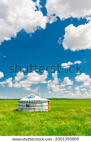 The traditional Mongolian tents on the Hulunbuir grassland in Inner Mongolia, China. Royalty-Free Stock Photo #2001390809